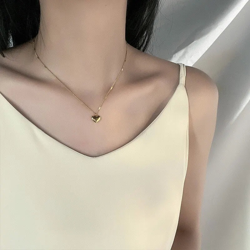 Collier doré avec pendentif cœur